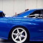 blue car with white wheels