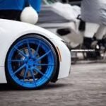 blue wheels on a white car